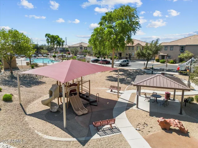 a view of a patio with swimming pool table and chairs