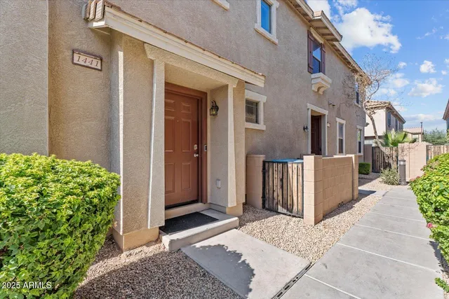 a view of a house with a small yard