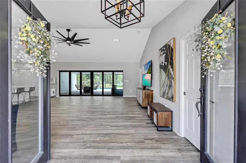 13362 Downy Woodpecker Road Weeki Wachee, FL 34614 - Photo 3 of 26 a view of entryway with livingroom