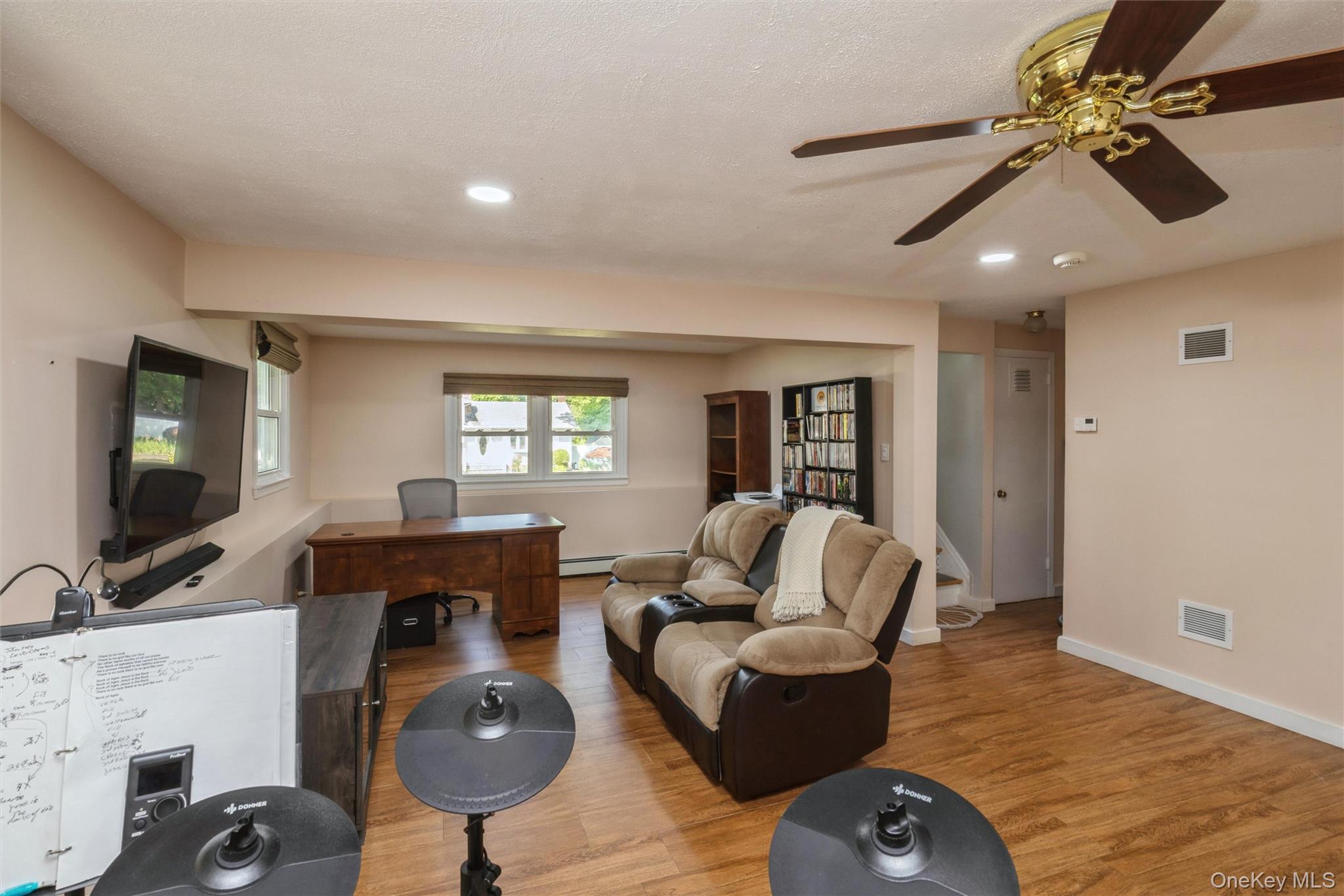 115 Clarendon Road Ronkonkoma, NY 11779 - Photo 22 of 45 Spacious room featuring wood-finish flooring, recessed lighting, and a ceiling fan