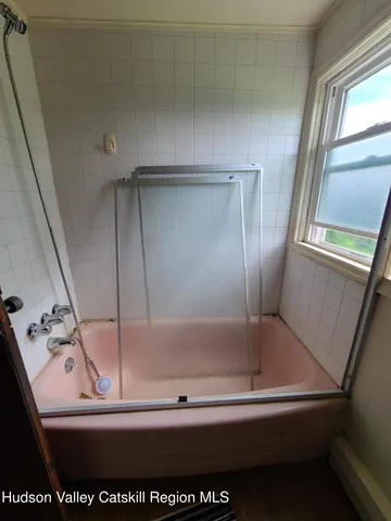 a view of bath room with a bathtub