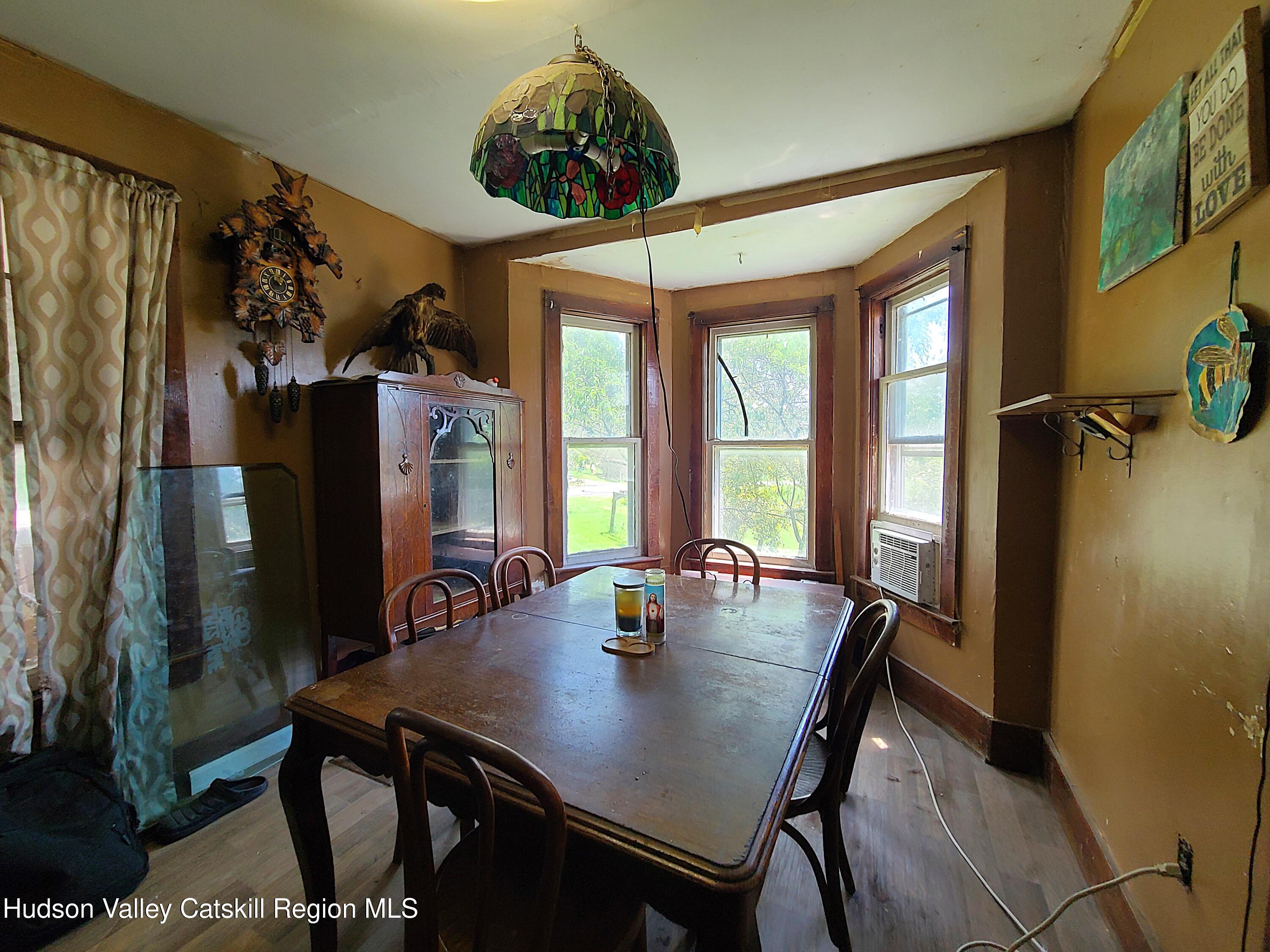 301 Stump Pond Road Livingston Manor, NY 12758 - Photo 23 of 49 a view of a dining room with furniture window and outside view