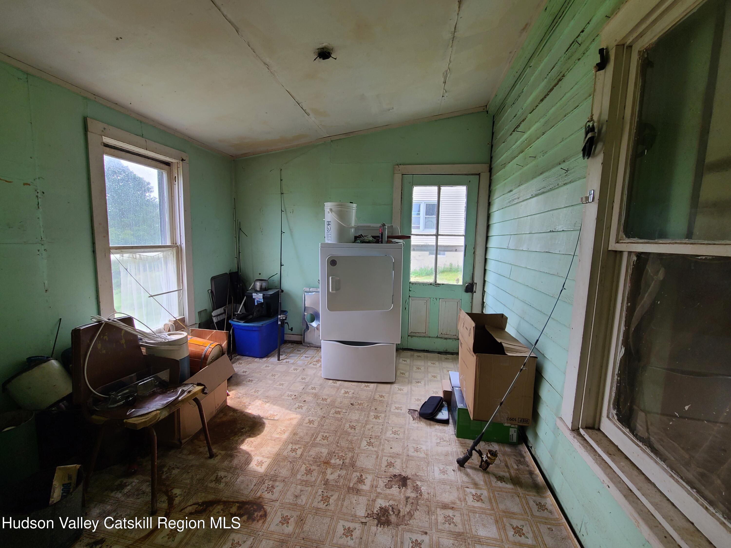 301 Stump Pond Road Livingston Manor, NY 12758 - Photo 26 of 49 a living room with furniture and a window