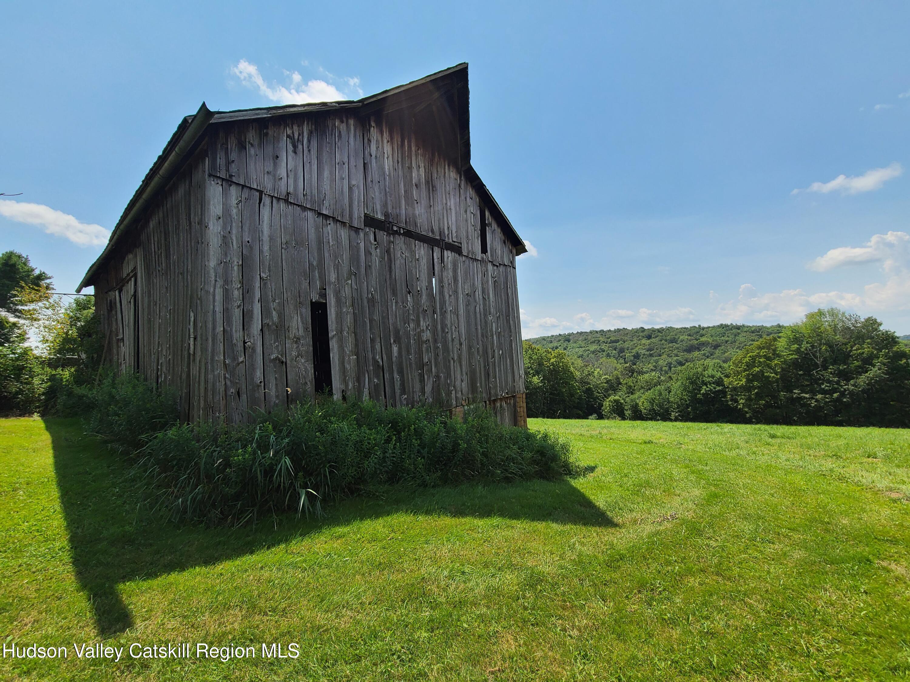 301 Stump Pond Road Livingston Manor, NY 12758 - Photo 6 of 49 a house with a yard