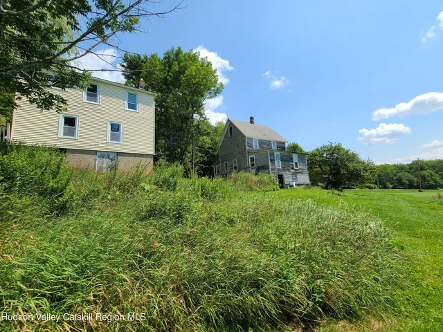 a backyard of a house with lots of green space