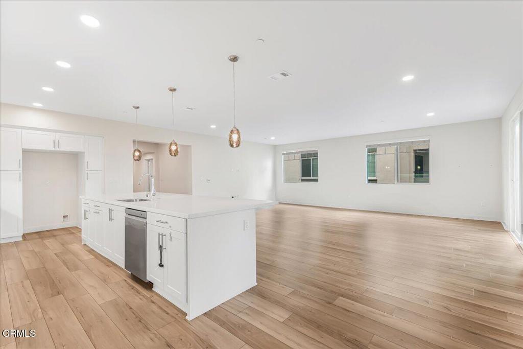 2830 Wagon Wheel Road, Unit 304 Oxnard, CA 93036 - Photo 8 of 44 a kitchen with stainless steel appliances granite countertop a stove and a sink