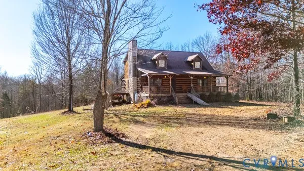 a front view of a house with a yard covered in snow