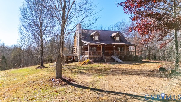 a front view of a house with a yard covered in snow