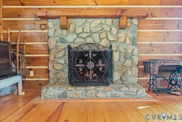 a view of a fireplace with wooden floor
