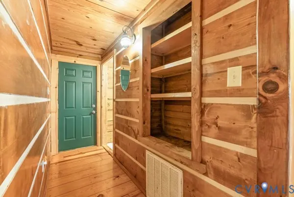 a view of a door and an empty room