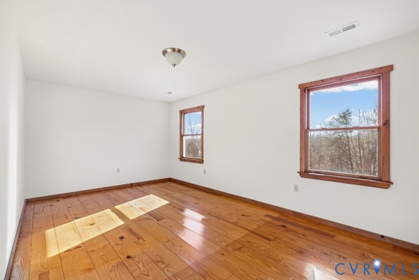 2371 Cedar Bend Road Appomattox, VA 24522 - Photo 29 of 50 a view of an empty room with wooden floor and a window