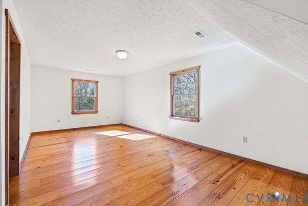 2371 Cedar Bend Road Appomattox, VA 24522 - Photo 33 of 50 a view of an empty room with wooden floor and a window