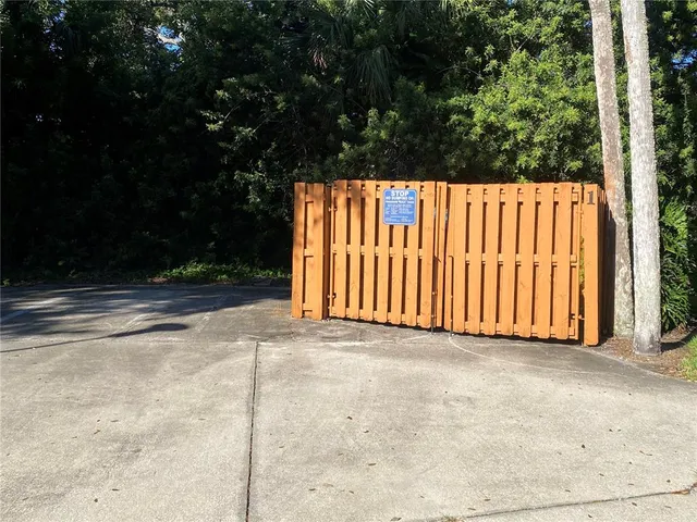 a view of a street with a yard