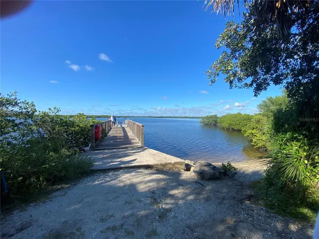a view of a lake with a yard