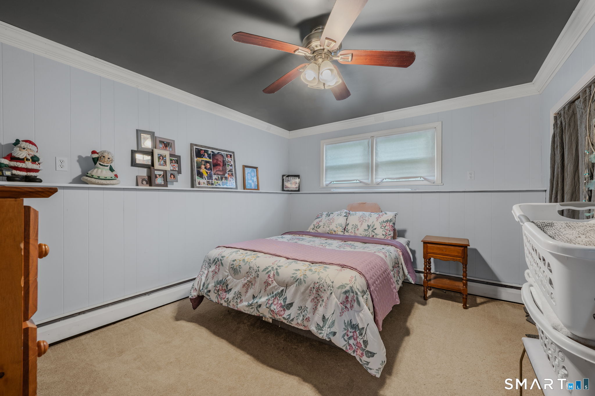 20 Willow Lane Ledyard, CT 06339 - Photo 17 of 21 a bedroom with a bed and a chandelier