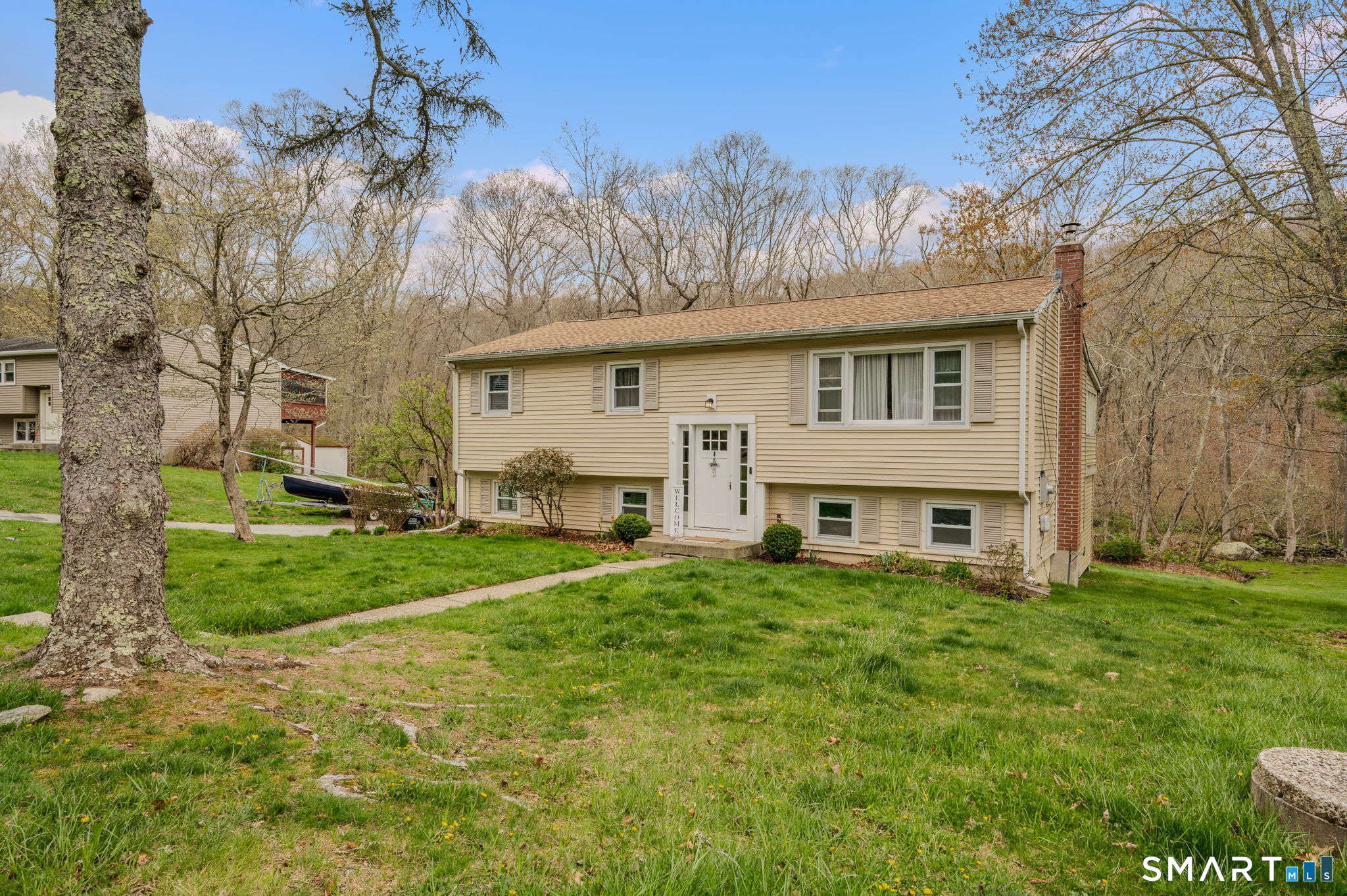 20 Willow Lane Ledyard, CT 06339 - Photo 3 of 21 a view of a house with a big yard and large trees