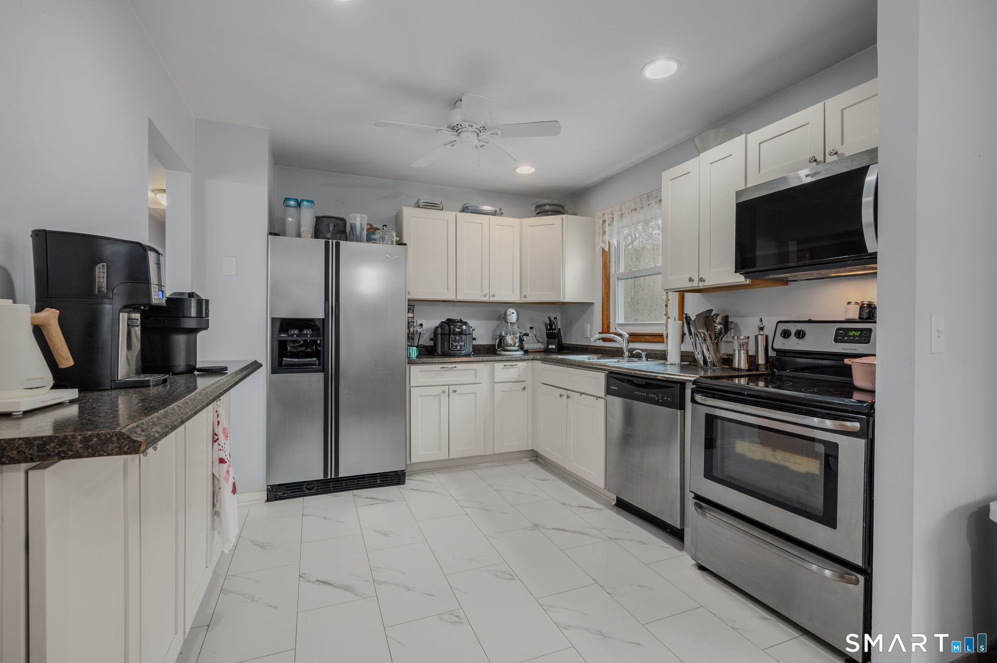 20 Willow Lane Ledyard, CT 06339 - Photo 4 of 21 a kitchen with stainless steel appliances granite countertop a refrigerator sink and microwave