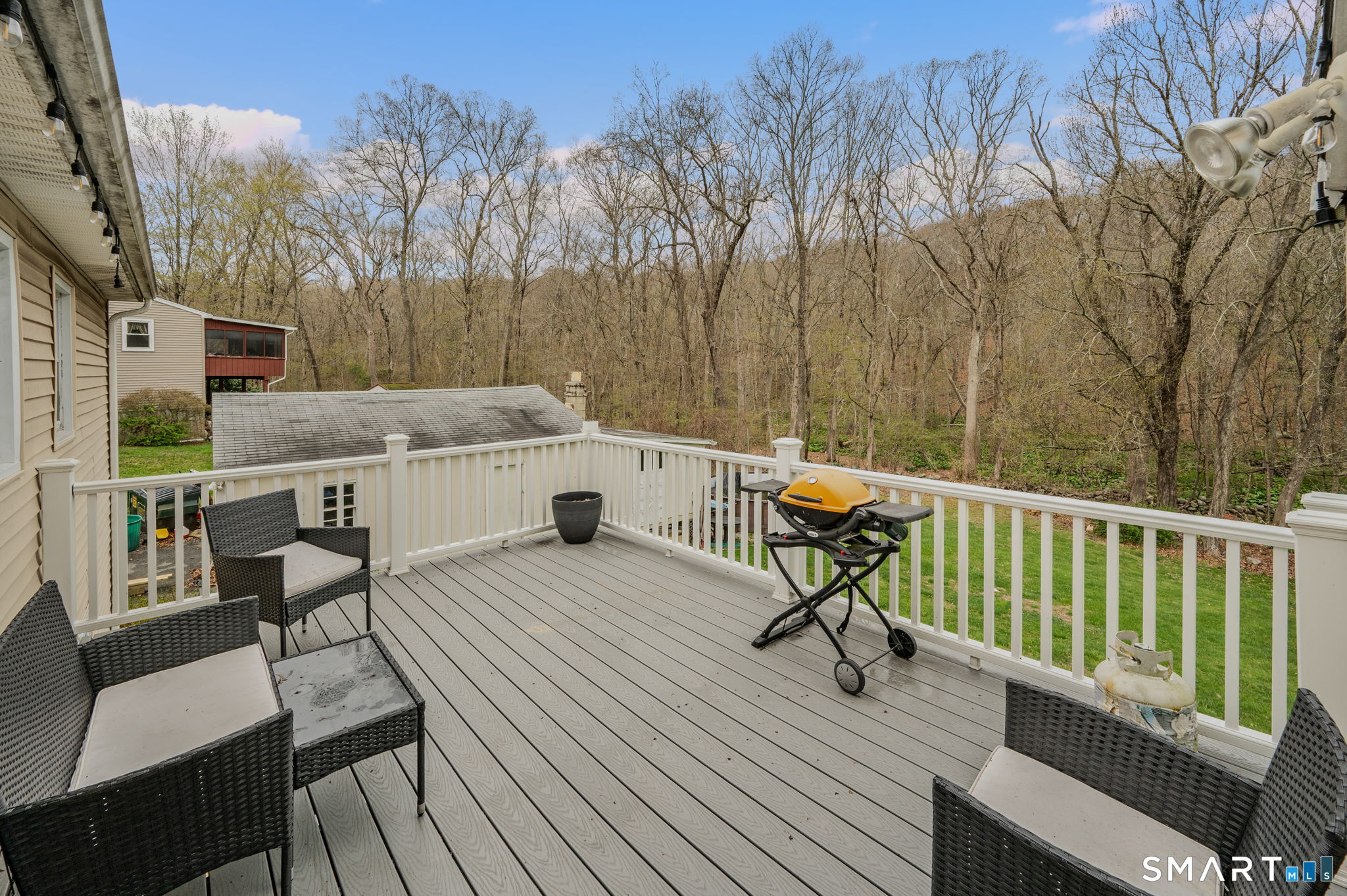 20 Willow Lane Ledyard, CT 06339 - Photo 7 of 21 a view of a deck with furniture and a yard