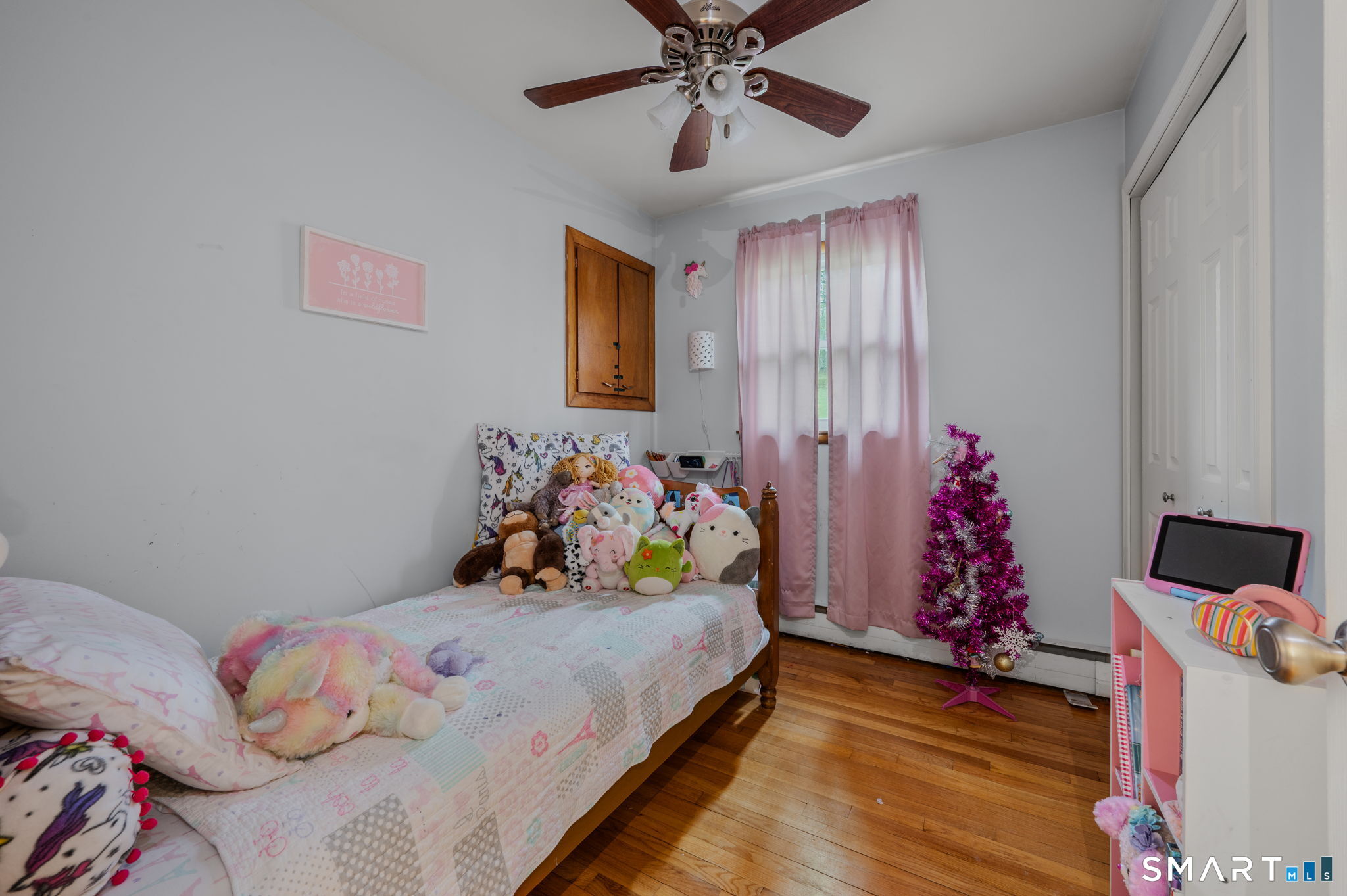 20 Willow Lane Ledyard, CT 06339 - Photo 10 of 21 a bedroom with a bed and a chandelier
