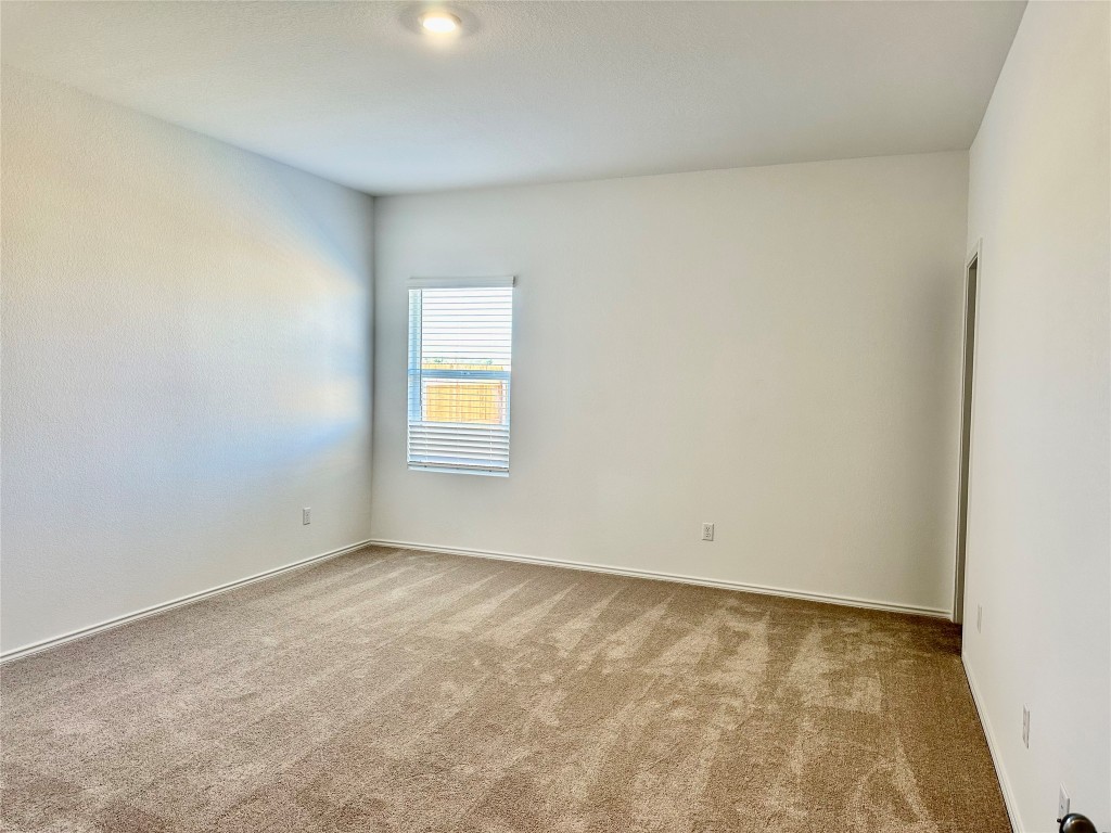 345 The Bad Way Jarrell, TX 76537 - Photo 9 of 34 an empty room with a window