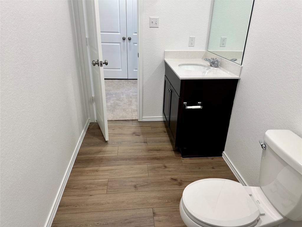 345 The Bad Way Jarrell, TX 76537 - Photo 16 of 34 a bathroom with a sink and a mirror