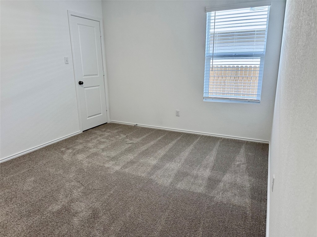 345 The Bad Way Jarrell, TX 76537 - Photo 17 of 34 an empty room with a window