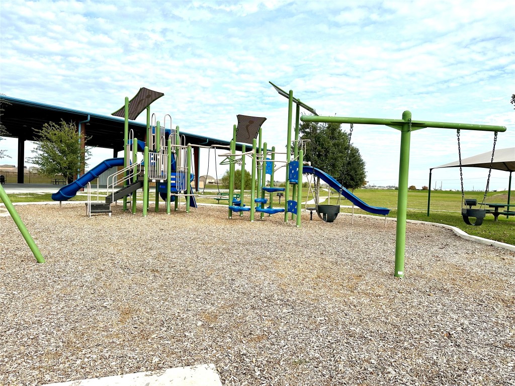 345 The Bad Way Jarrell, TX 76537 - Photo 26 of 34 a view of park with slide