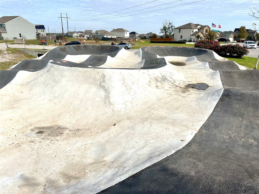 345 The Bad Way Jarrell, TX 76537 - Photo 32 of 34 a view of a swimming pool with a lounge chairs