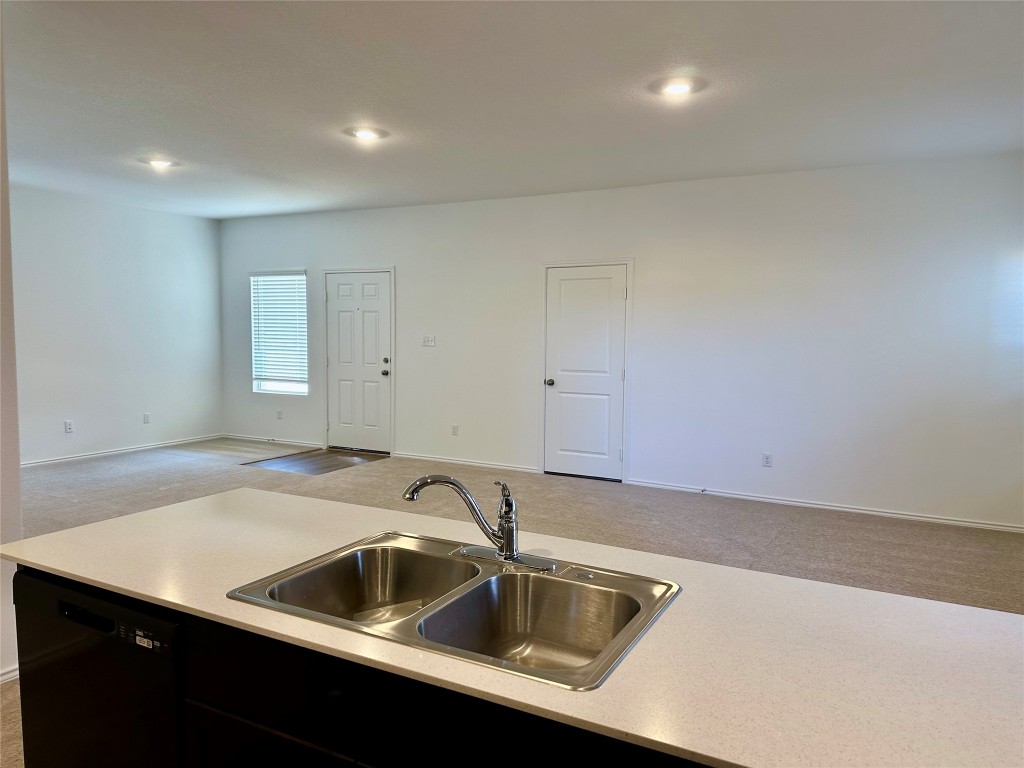 345 The Bad Way Jarrell, TX 76537 - Photo 34 of 34 a kitchen that has a sink and a stove