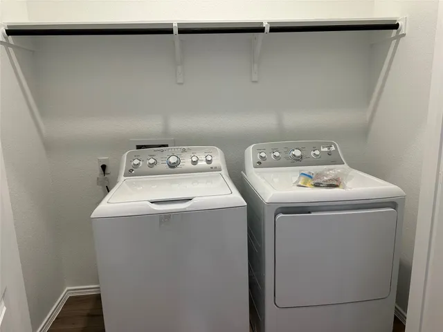 a kitchen with kitchen island sink and refrigerator