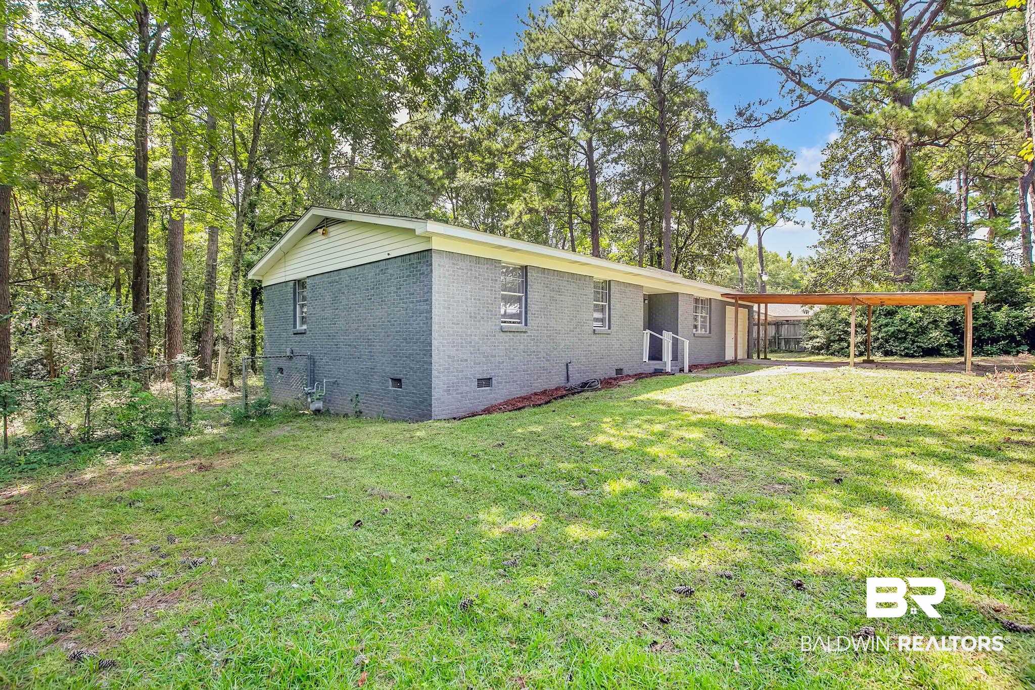 3304 Armond Drive Mobile, AL 36605 - Photo 39 of 62 Back of house featuring crawl space, brick siding, and a carport