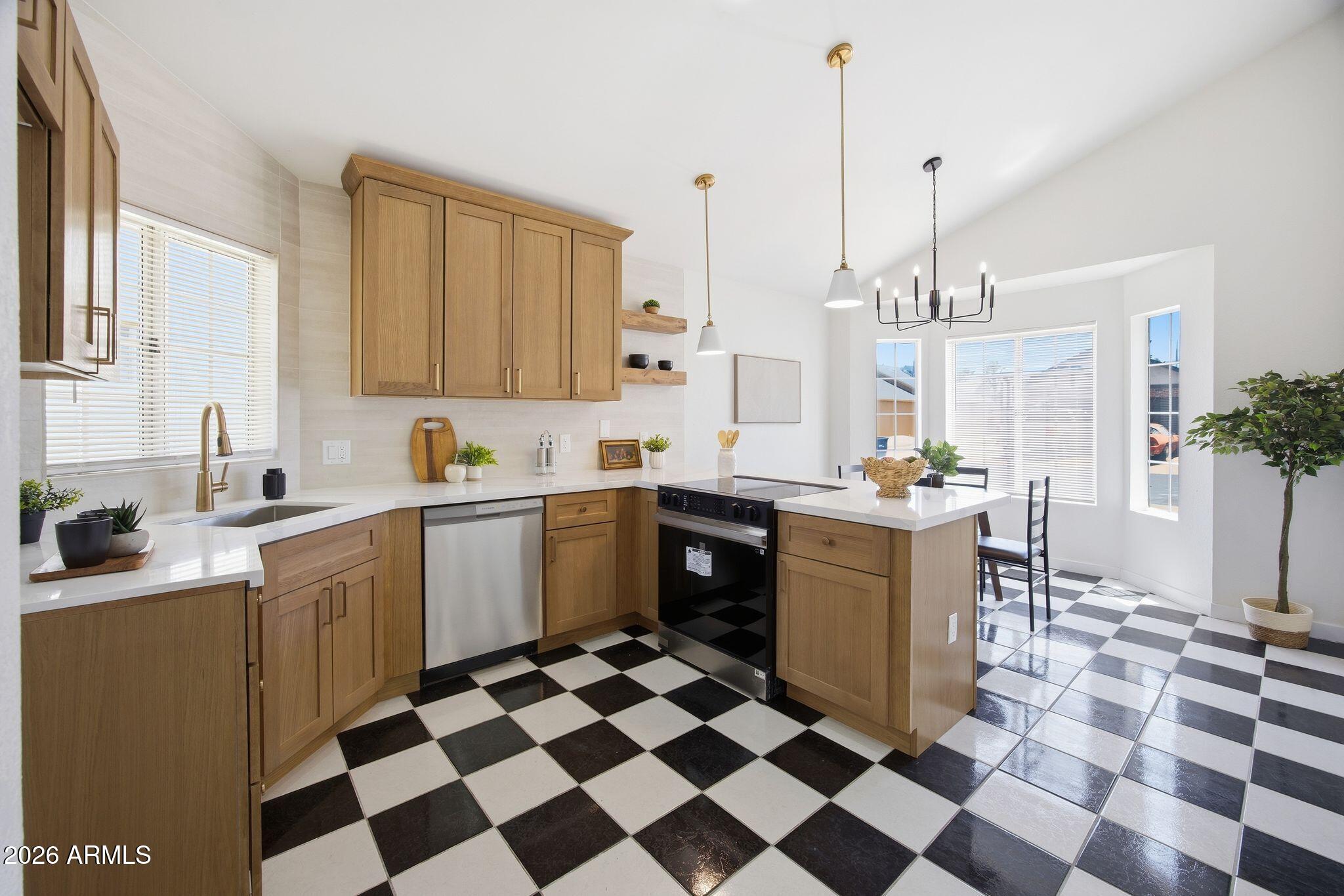 3134 East McKellips Road, Unit 69 Mesa, AZ 85213 - Photo 7 of 24 a kitchen with a stove a sink and cabinets