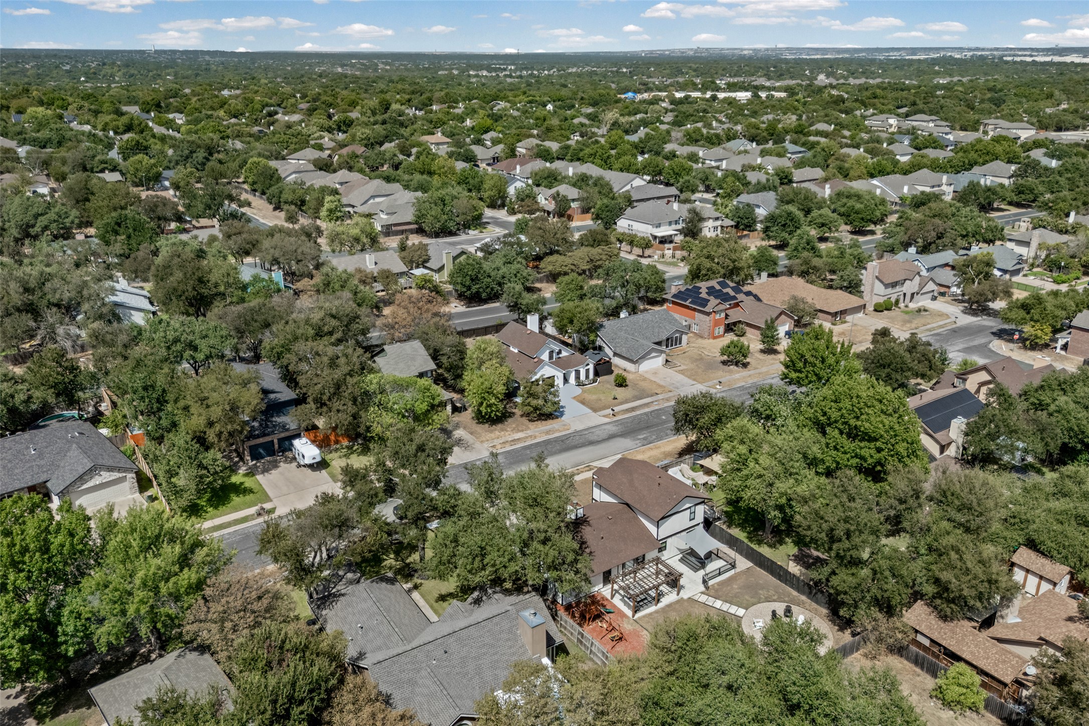 3006 Overland Street Round Rock, TX 78681 - Photo 28 of 29 An aerial perspective reveals a quiet suburban neighborhood surrounded by mature trees.