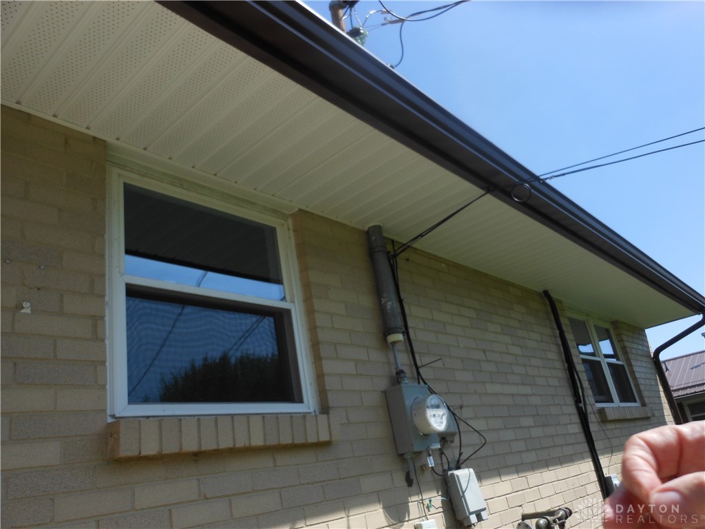 143 West Emerick Road West Milton, OH 45383 - Photo 29 of 37 This property features durable brick construction and practical rain gutters for home maintenance.
