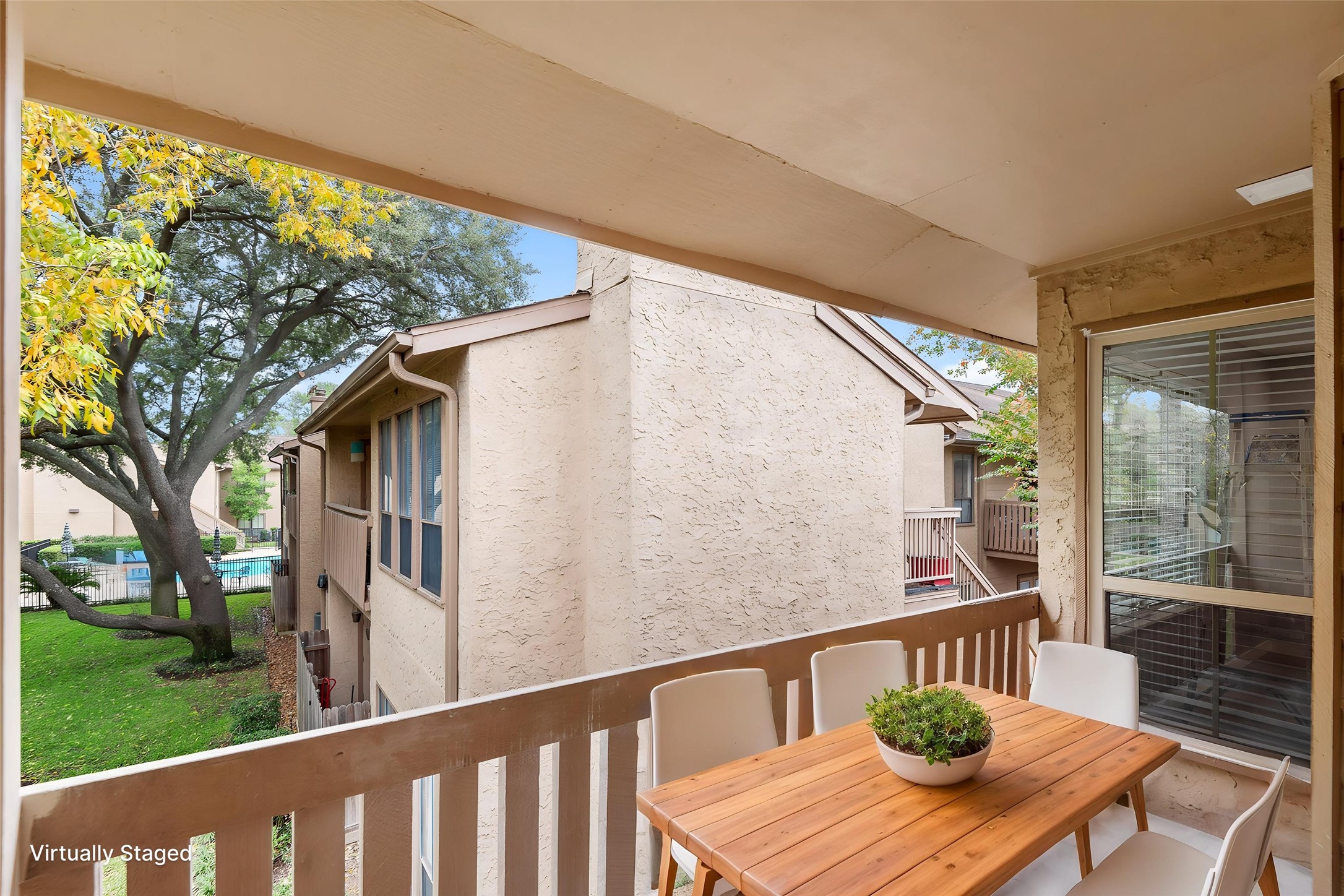5000 Milwee Street, Unit 54 Houston, TX 77092 - Photo 21 of 25 Your own private perch — morning coffee and a sparkling pool view waiting just outside your door. Virtually staged.