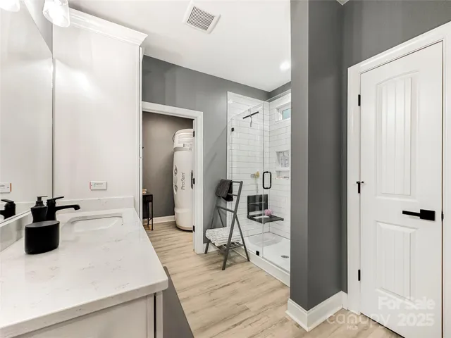 a kitchen with a sink and refrigerator