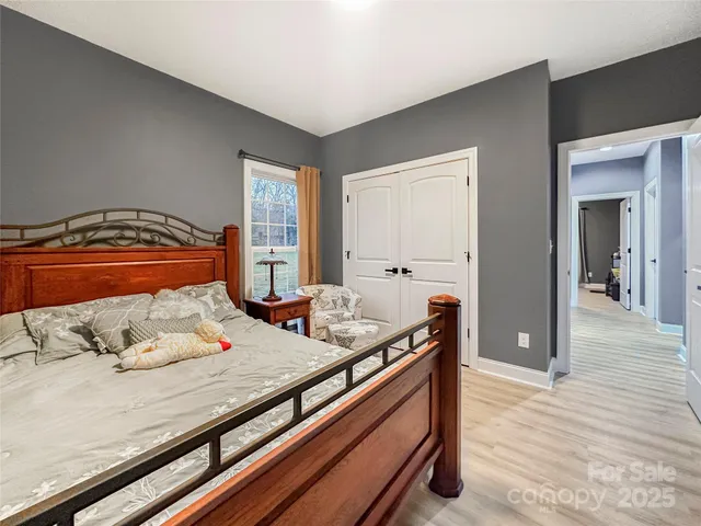 a bedroom with bed and window