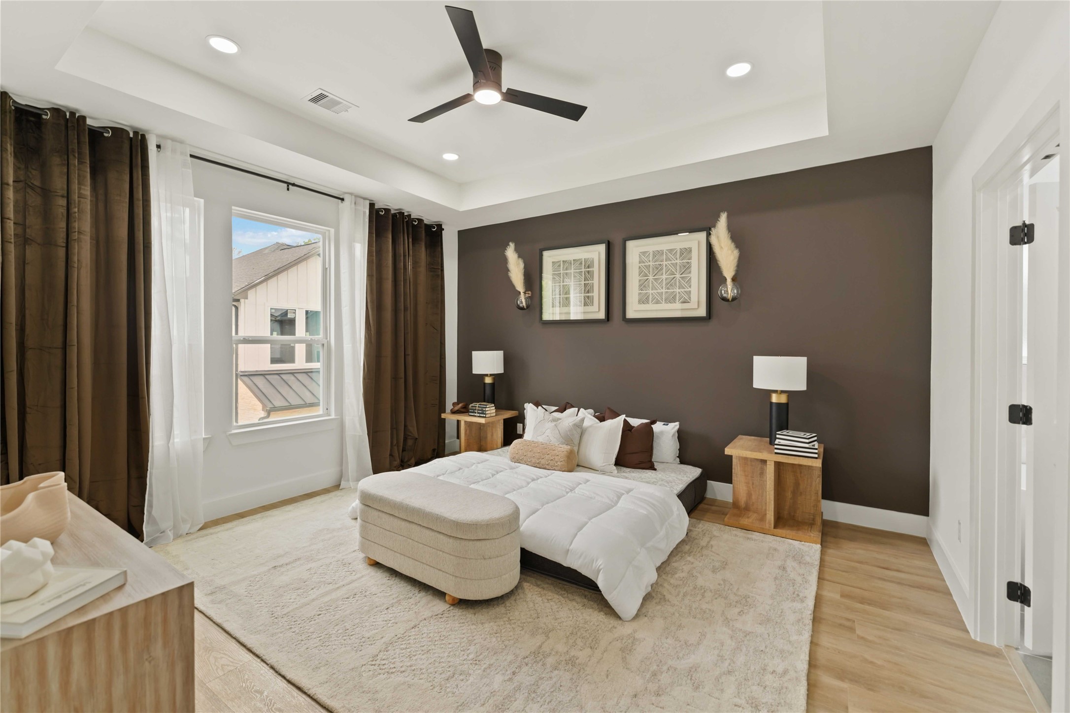 6539 Sealey Street Houston, TX 77091 - Photo 15 of 28 a bedroom with a large bed and ceiling fan