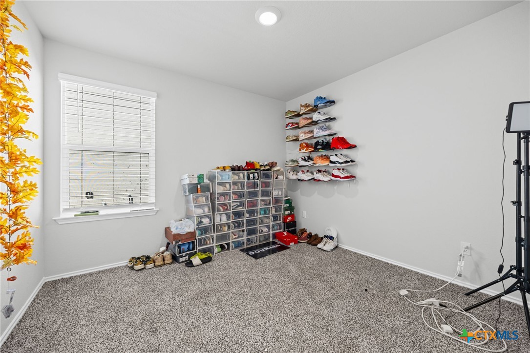 7203 Gilbert Drive Killeen, TX 76549 - Photo 14 of 16 a room with toys and a chandelier