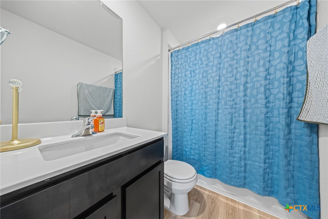7203 Gilbert Drive Killeen, TX 76549 - Photo 15 of 16 a bathroom with a sink a toilet and mirror