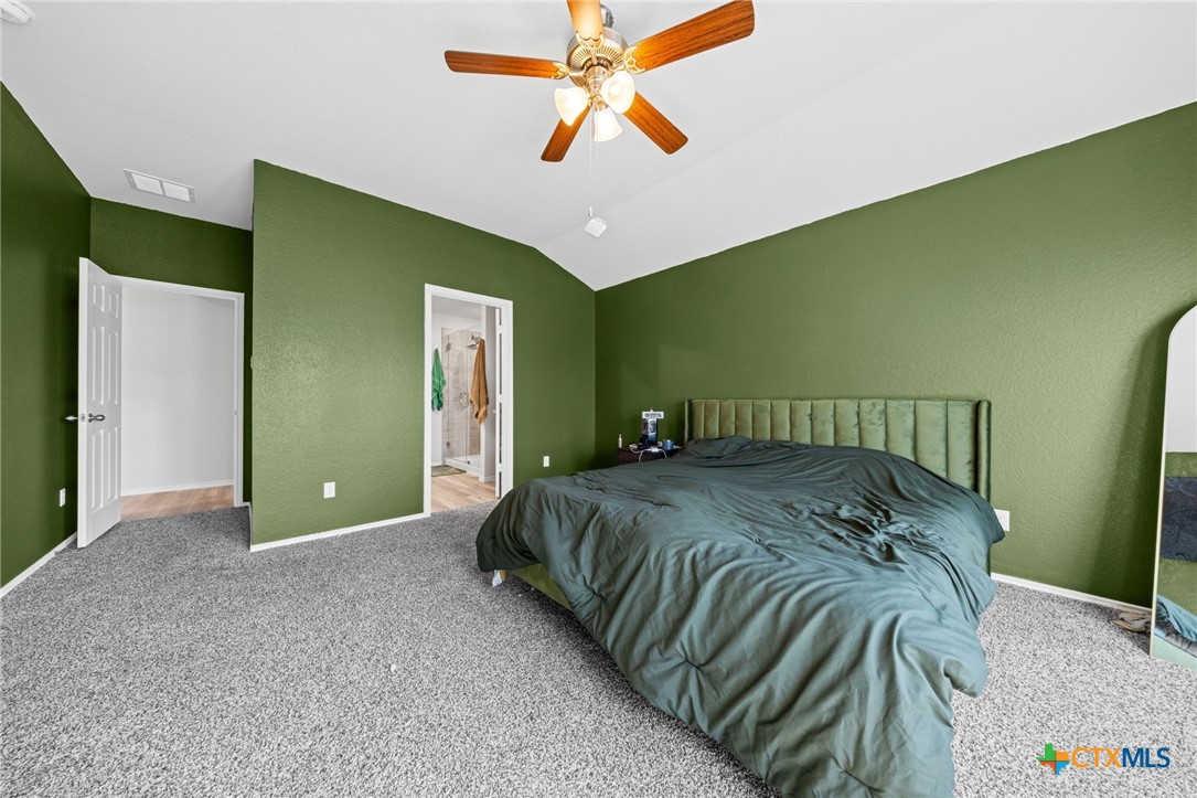7203 Gilbert Drive Killeen, TX 76549 - Photo 10 of 16 a bedroom with a bed and a chandelier