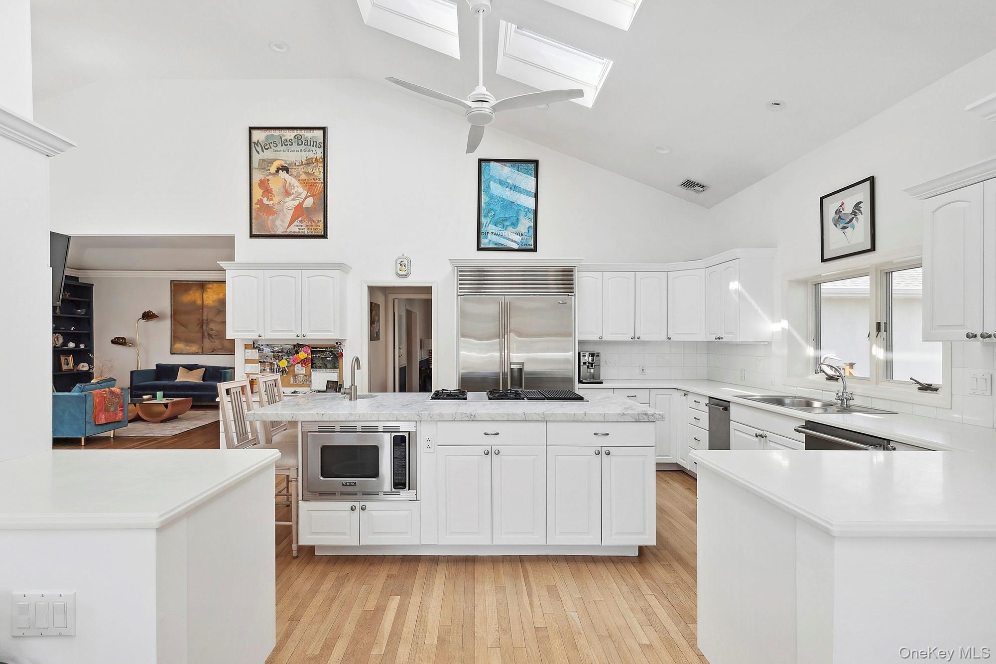 61 Factory Pond Road Locust Valley, NY 11560 - Photo 14 of 35 a kitchen with a sink cabinets and wooden floor