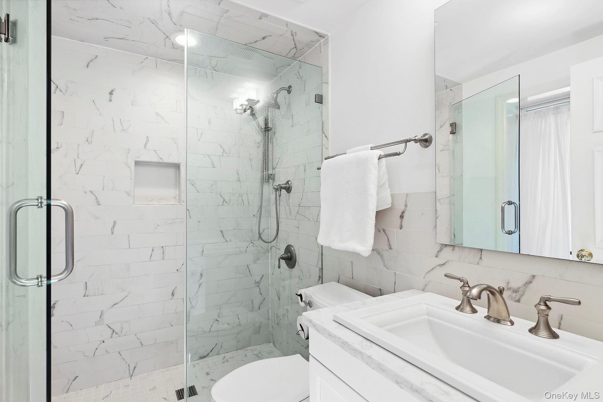 61 Factory Pond Road Locust Valley, NY 11560 - Photo 18 of 35 a bathroom with a sink toilet and shower