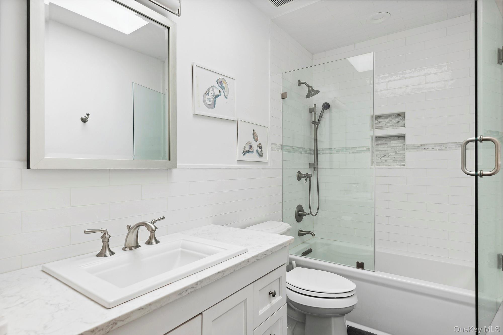 61 Factory Pond Road Locust Valley, NY 11560 - Photo 21 of 35 a bathroom with a sink toilet and shower