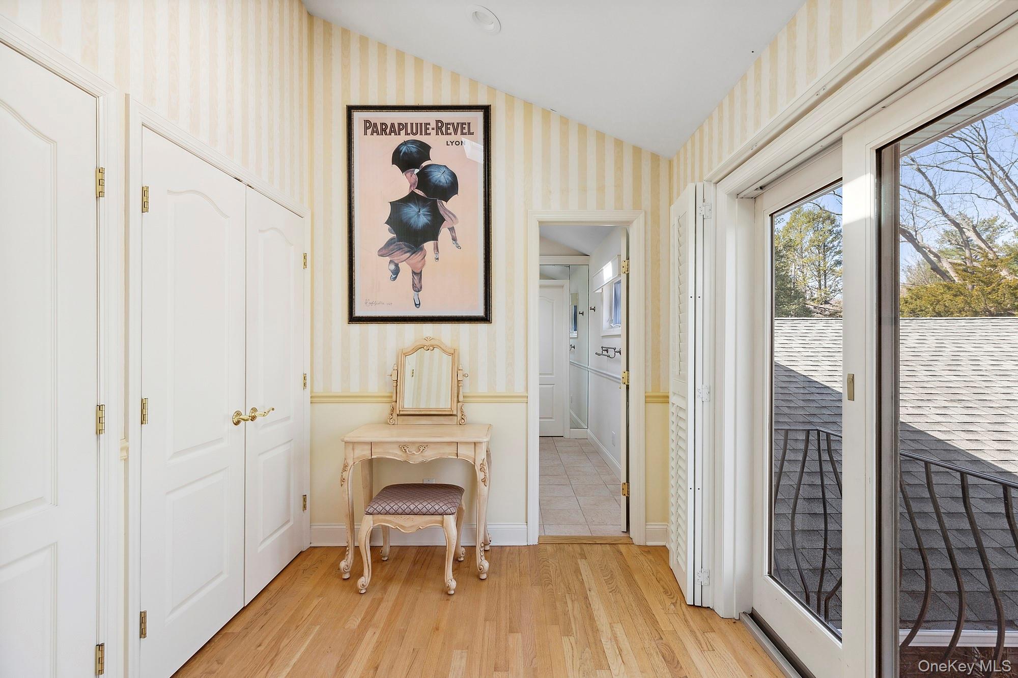 61 Factory Pond Road Locust Valley, NY 11560 - Photo 28 of 35 a view of a bedroom with a bed and wooden floor