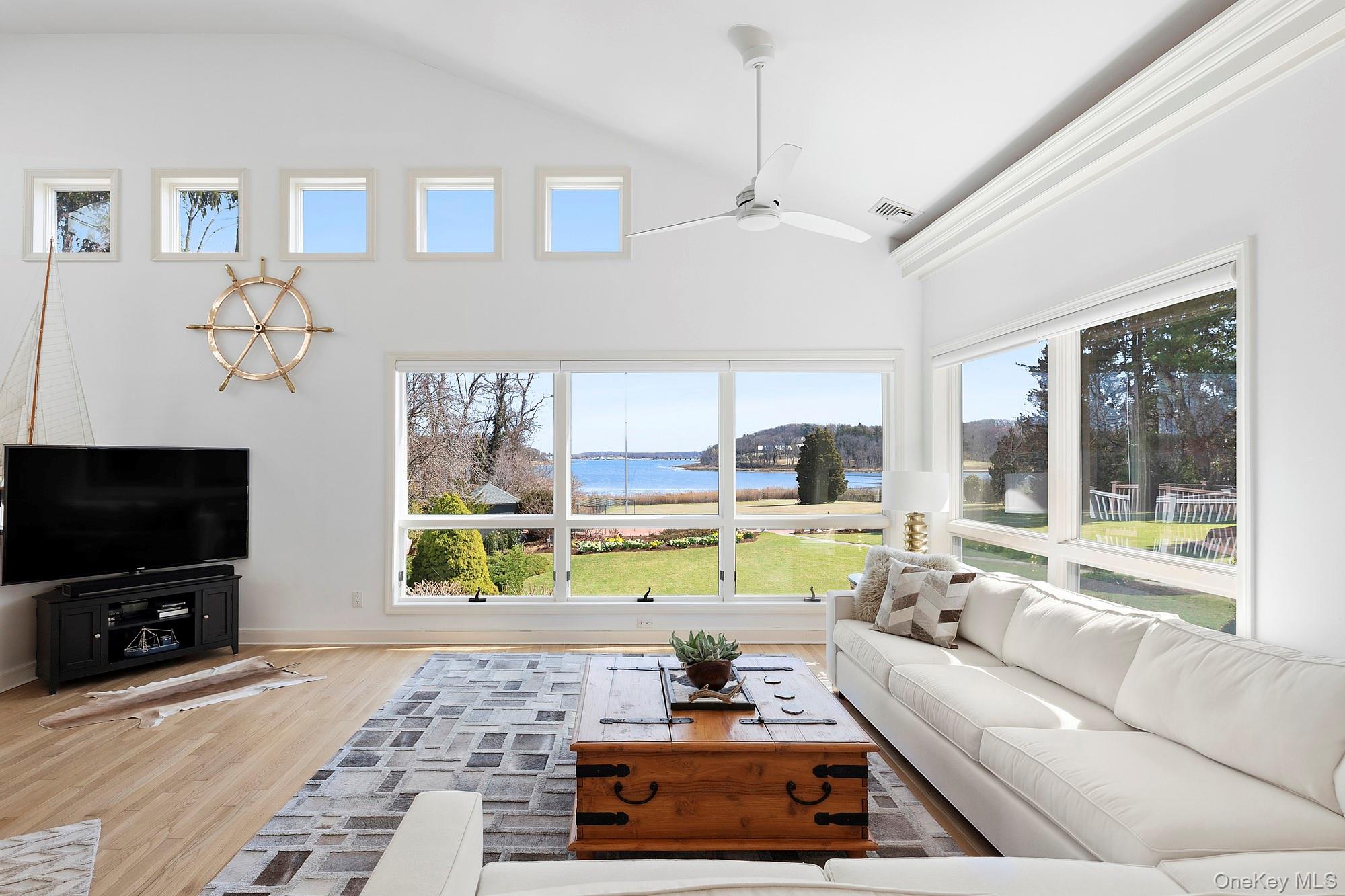 61 Factory Pond Road Locust Valley, NY 11560 - Photo 10 of 35 a living room with furniture and a flat screen tv