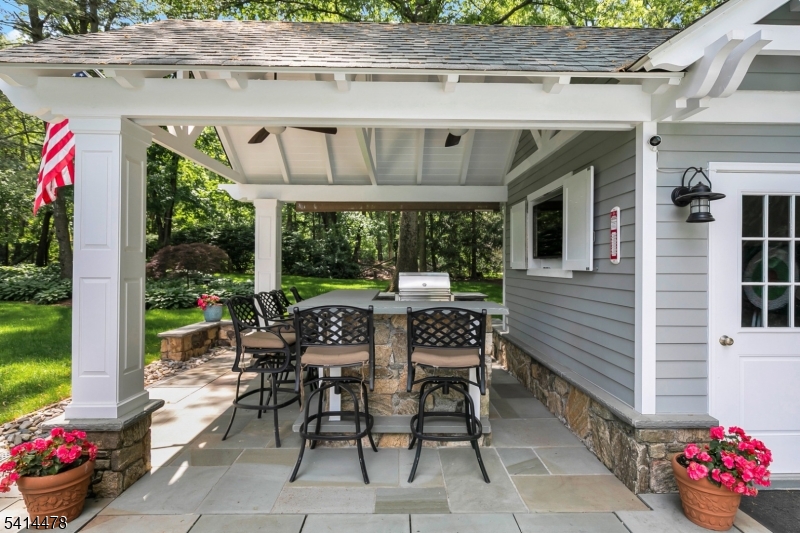 33 St Nickolas Way Bernards, NJ 07920 - Photo 42 of 50 a view of a patio with a table and chairs and potted plants