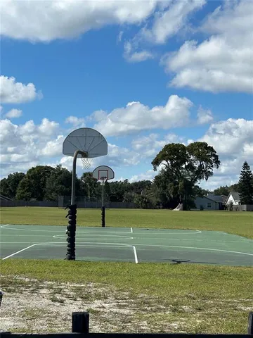 a view of a golf course with a lake view