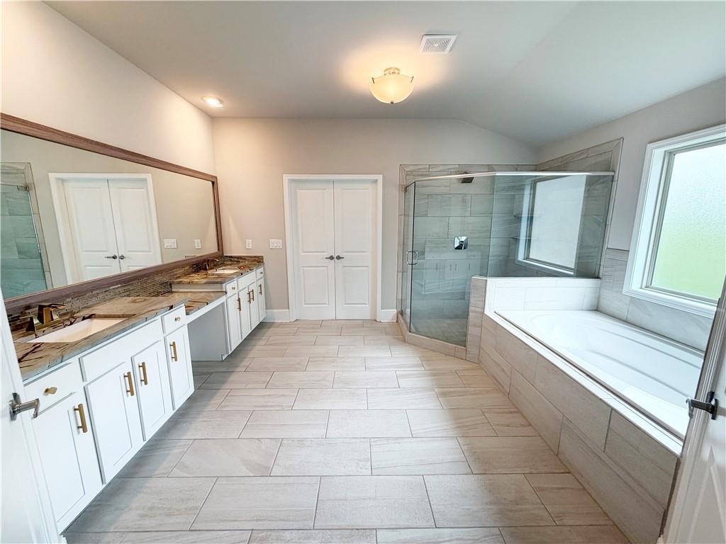 5296 Cheval Rue Court Suwanee, GA 30024 - Photo 24 of 51 a large white kitchen with a stove top oven a sink and dishwasher