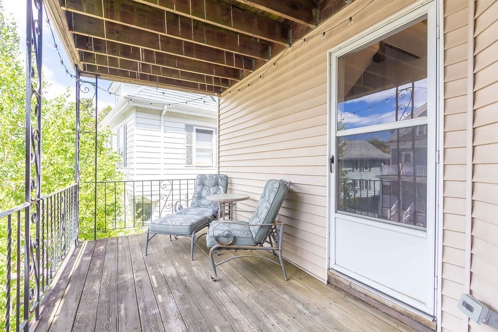 43 Sheffield Road, Unit 2 Boston, MA 02131 - Photo 11 of 16 a view of a porch with furniture and wooden floor